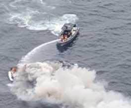 MCSO marine unit boats putting out a fire on another boat.